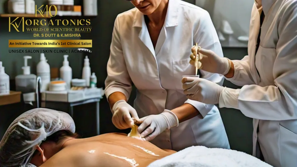 trained professional at KM Orgatonics applies a back treatment to a client in their clinical setting, demonstrating their commitment to hygienic and effective skincare procedures.