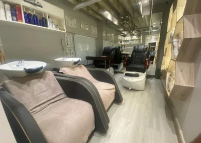 The comfortable hair washing and pedicure stations at KM Orgatonics salon and clinic in Gorakhpur, featuring plush chairs, clean basins, and a relaxing ambiance.