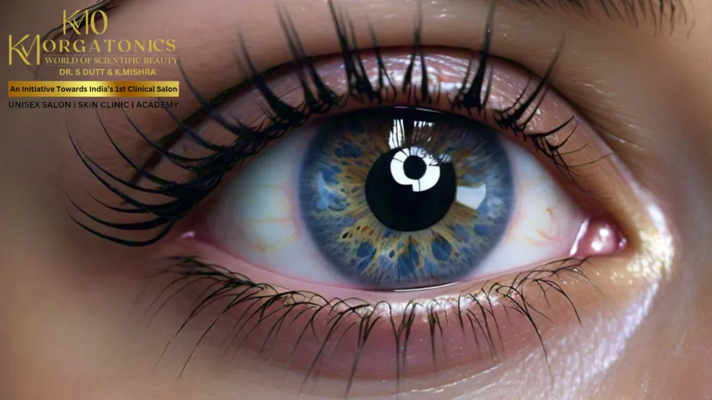 Close-up of a beautiful blue eye with long, dark lashes, showcasing the potential results of dark circle treatment at KM Orgatonics in Gorakhpur.