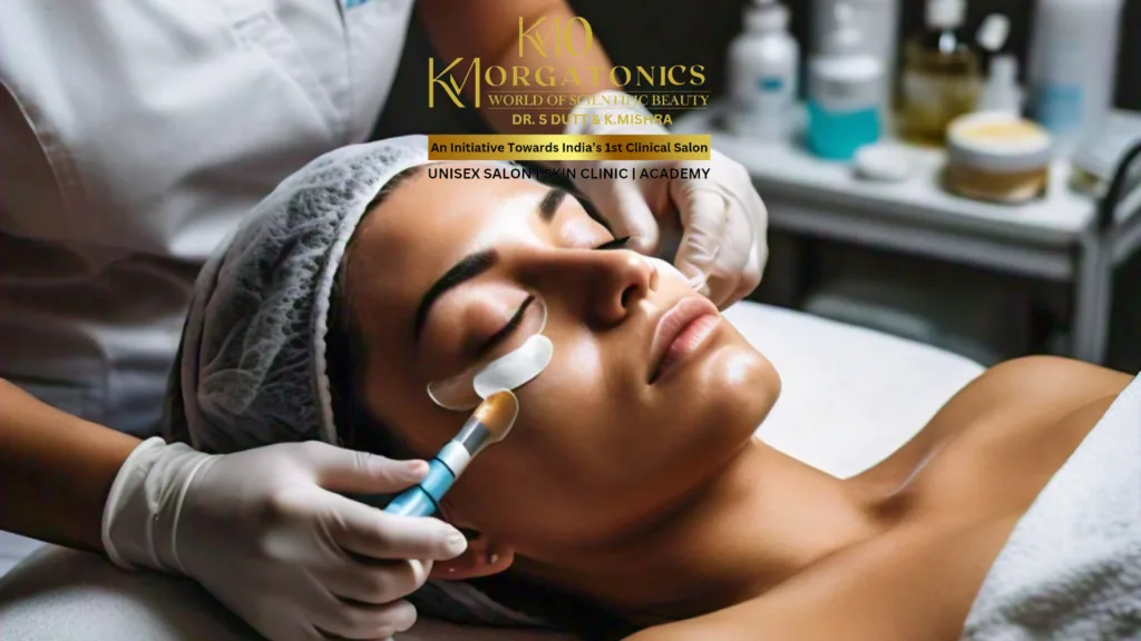 A client receiving professional under-eye treatment at KM Orgatonics in Gorakhpur. A technician applies a product under the eyes, suggesting a specialized dark circle reduction procedure.